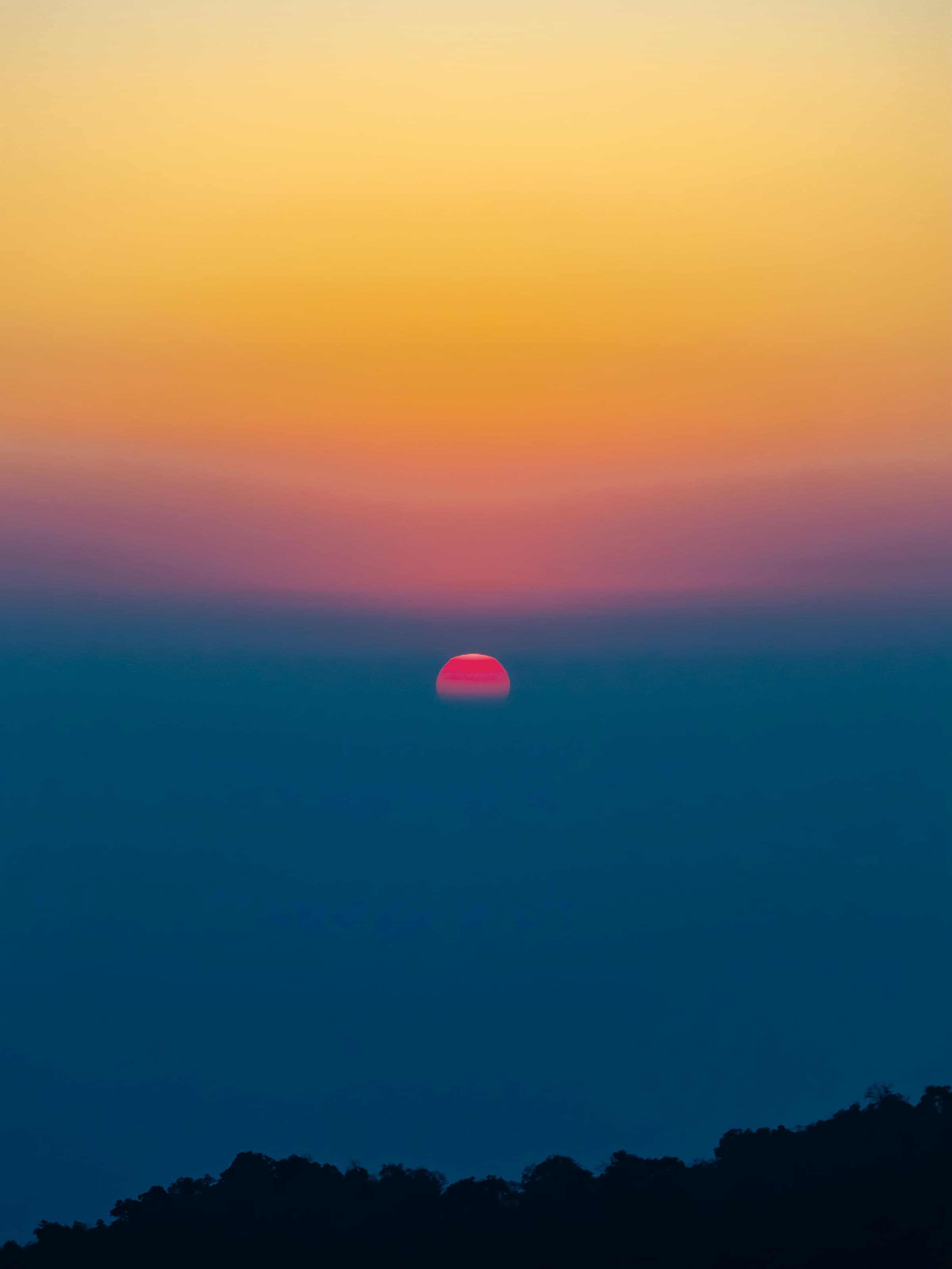 Stunning sunset over mountains - TinyStoked adventure books background showcasing outdoor exploration and nature